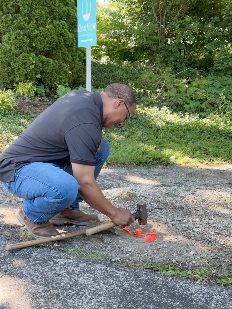 Anthony Sickle laying parcel corner marker